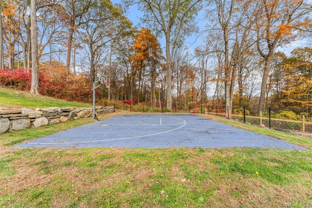 a front view of a house with swimming pool and sitting area
