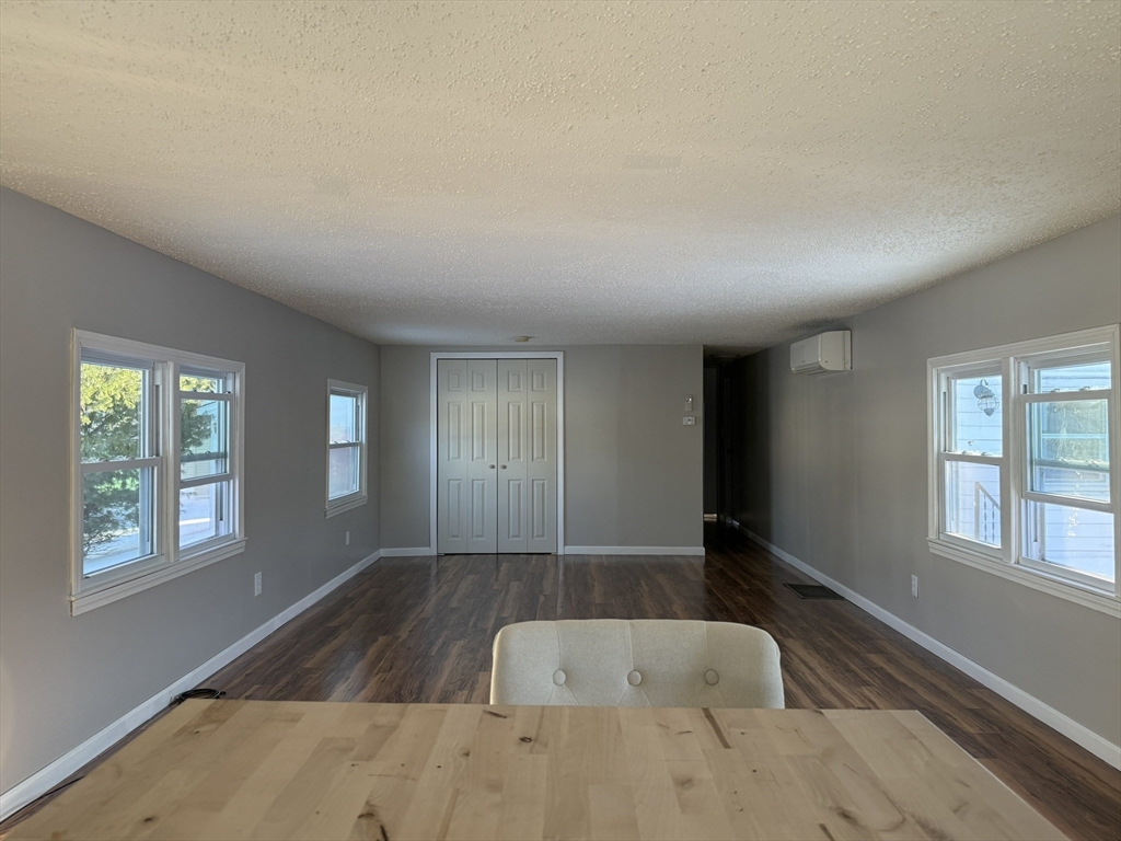 281 Chauncey Walker Street, Unit 188 Belchertown, MA 01007 - Photo 8 of 19 an empty room with windows