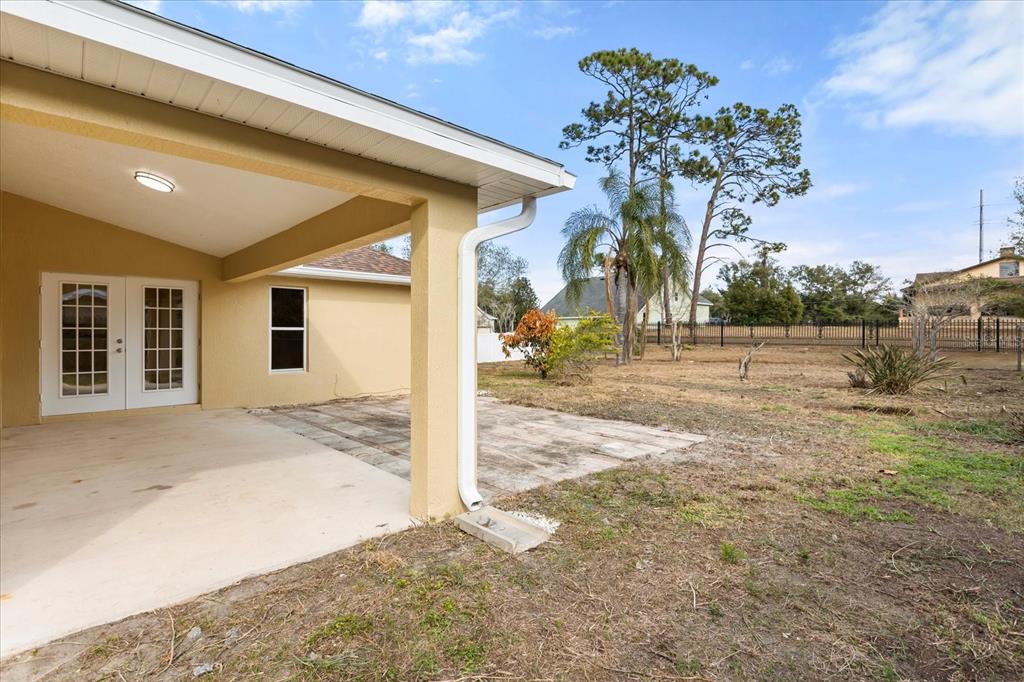 619 Rhodes Drive DeLand, FL 32720 - Photo 17 of 37 a view of a house with a tree in front