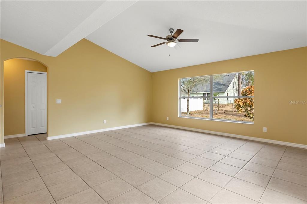619 Rhodes Drive DeLand, FL 32720 - Photo 22 of 37 a view of an empty room with a window