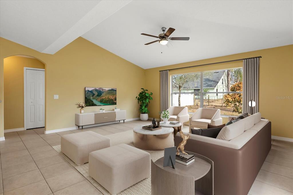 619 Rhodes Drive DeLand, FL 32720 - Photo 5 of 37 a living room with furniture and a large window