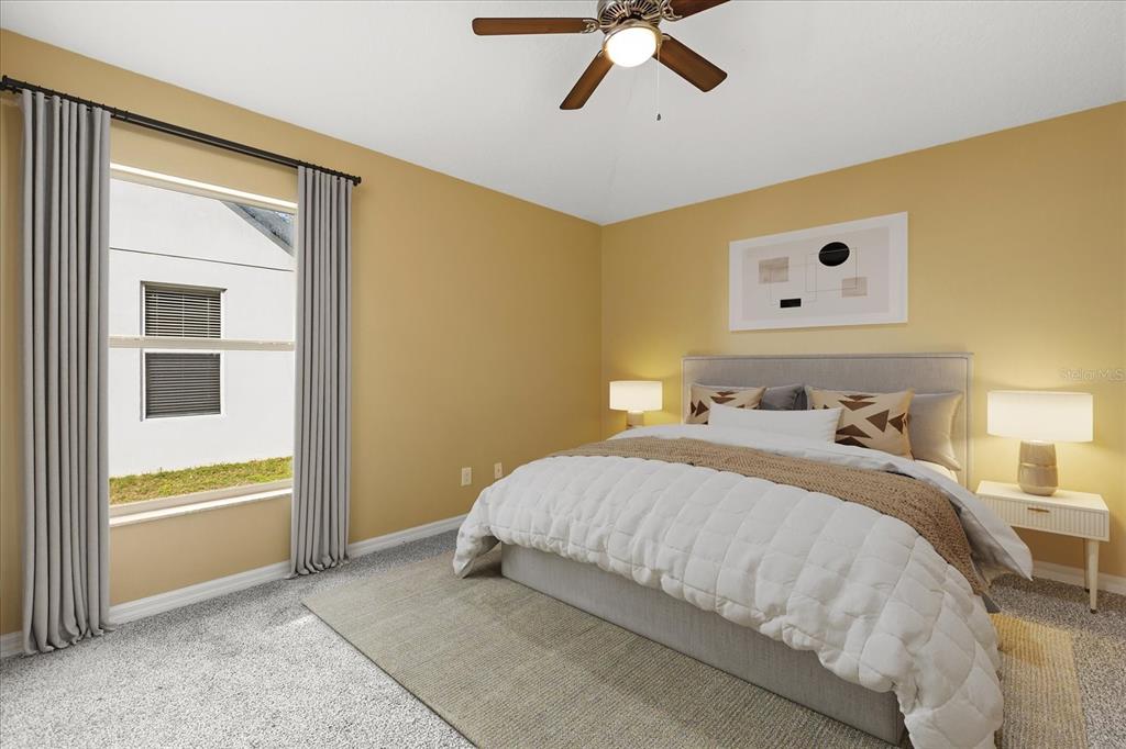 619 Rhodes Drive DeLand, FL 32720 - Photo 10 of 37 a bedroom with a bed and a window