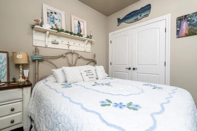 a view of a big house with a big yard and potted plants