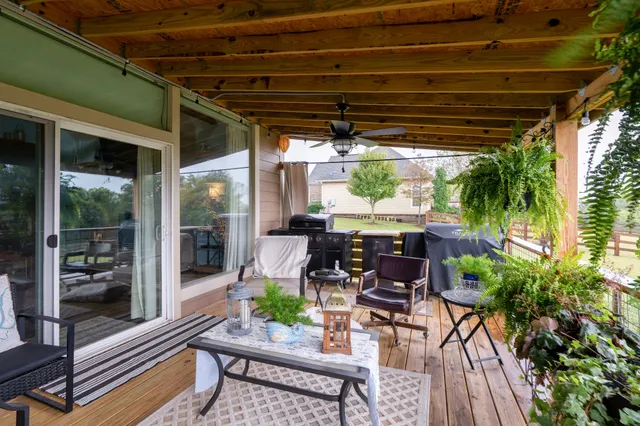 an aerial view of a house with a yard basket ball court and outdoor seating