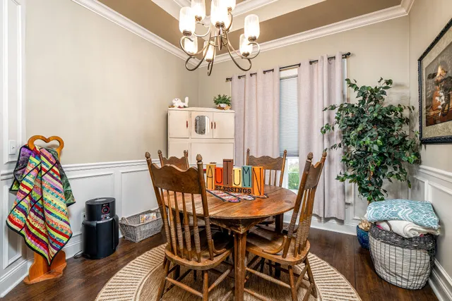 a kitchen with stainless steel appliances granite countertop a refrigerator a stove and a sink