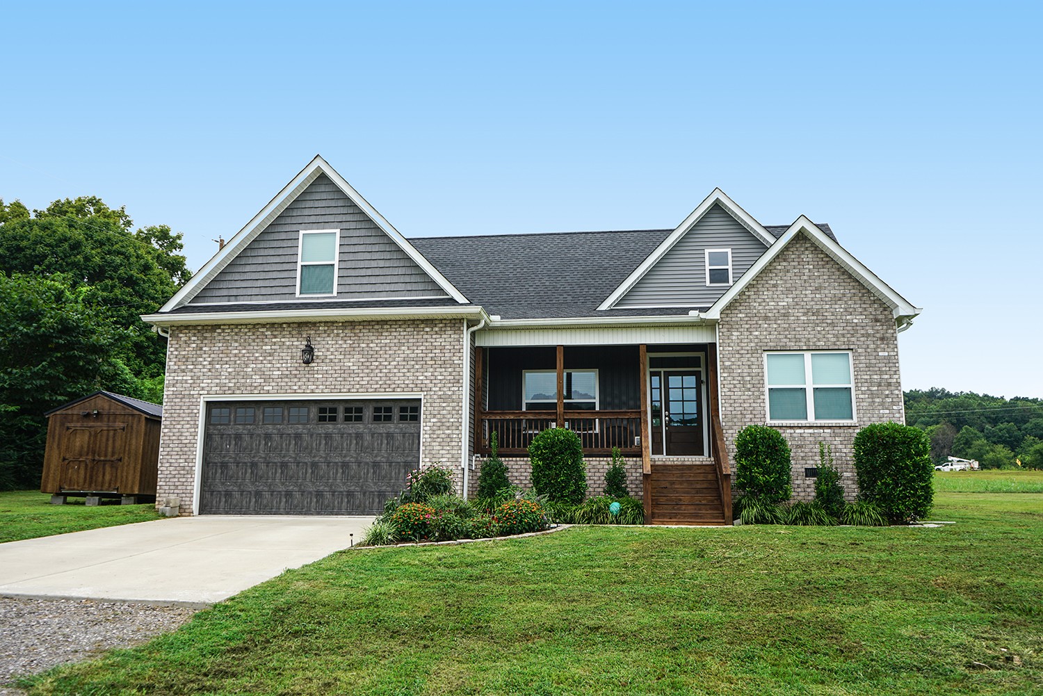 124 Piney Road Dickson, TN 37055 - Photo 1 of 39 a front view of a house with a yard and garage