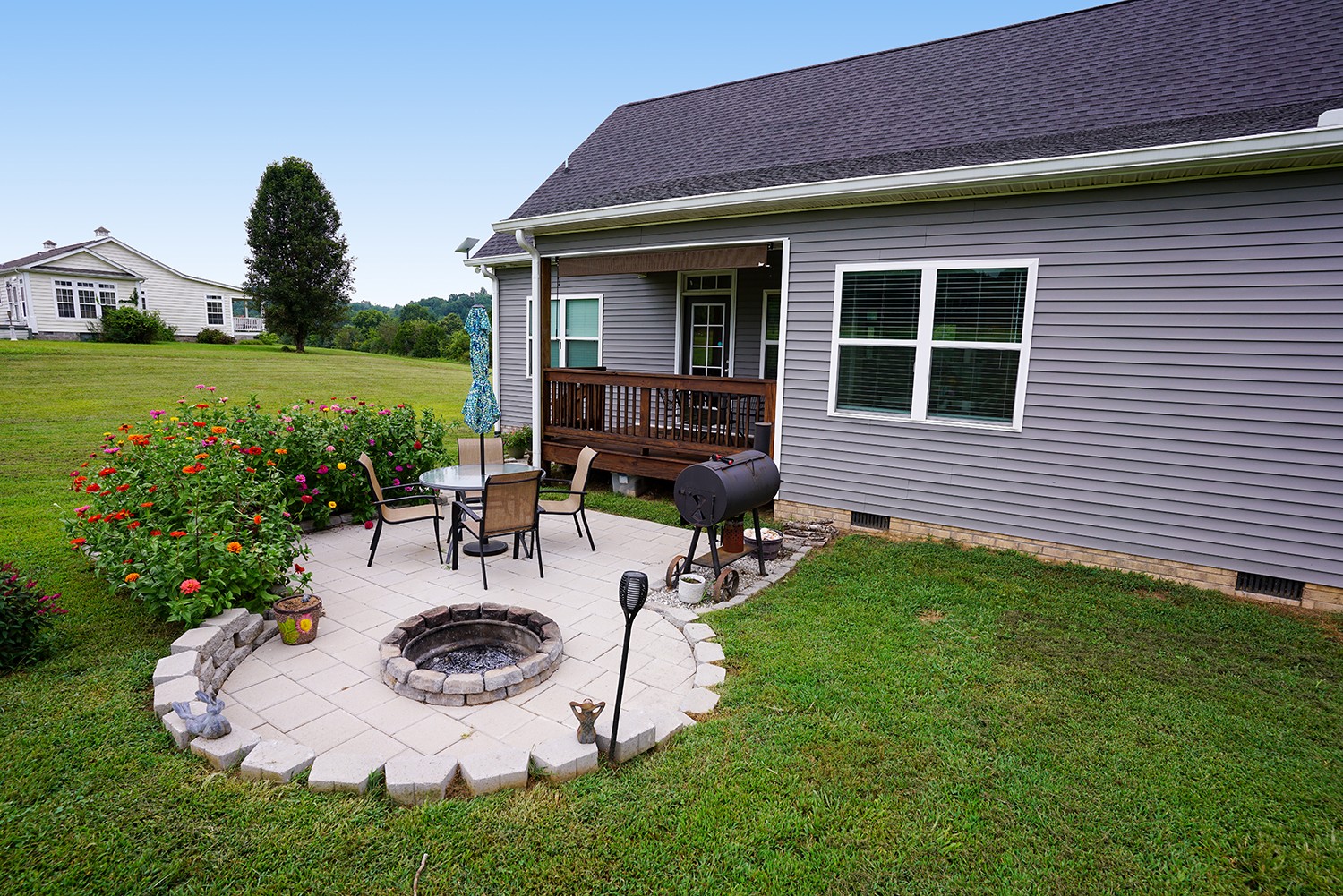 124 Piney Road Dickson, TN 37055 - Photo 11 of 39 a view of a house with backyard sitting area and garden