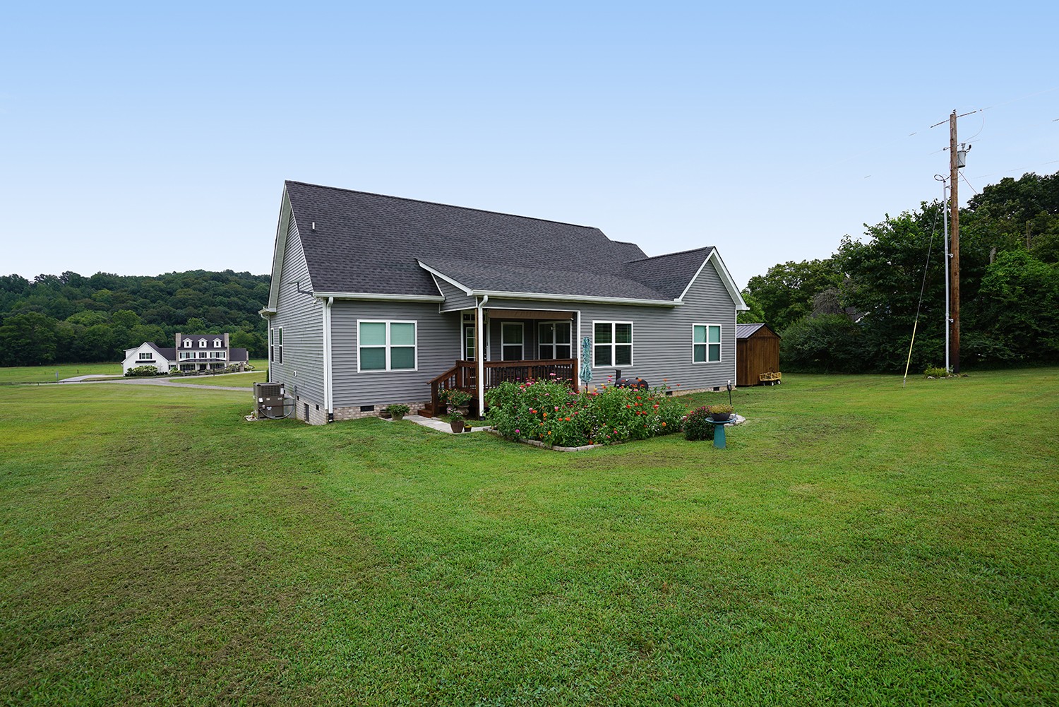 124 Piney Road Dickson, TN 37055 - Photo 13 of 39 a front view of a house with garden