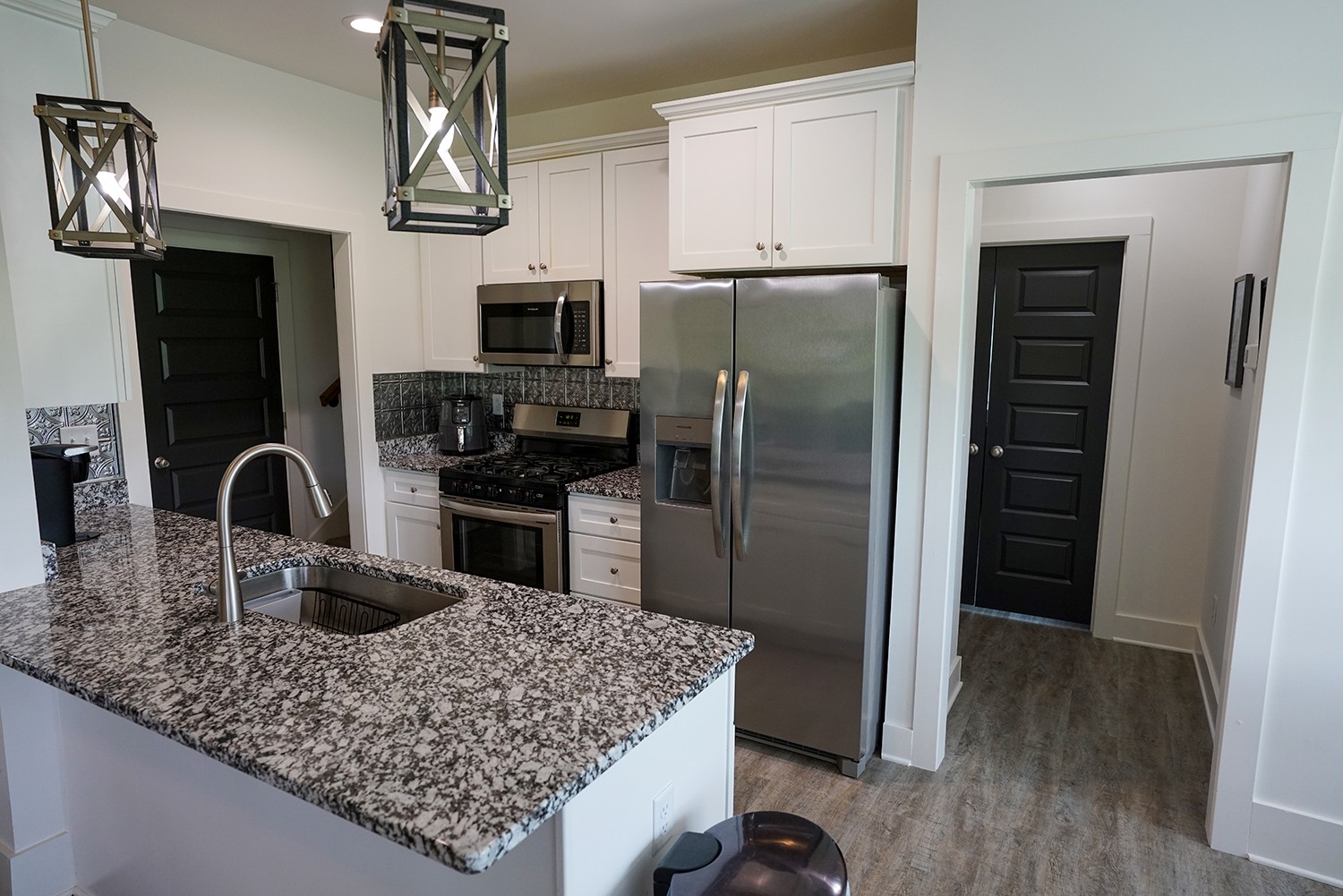 124 Piney Road Dickson, TN 37055 - Photo 17 of 39 a kitchen with stainless steel appliances granite countertop a refrigerator a stove and a sink