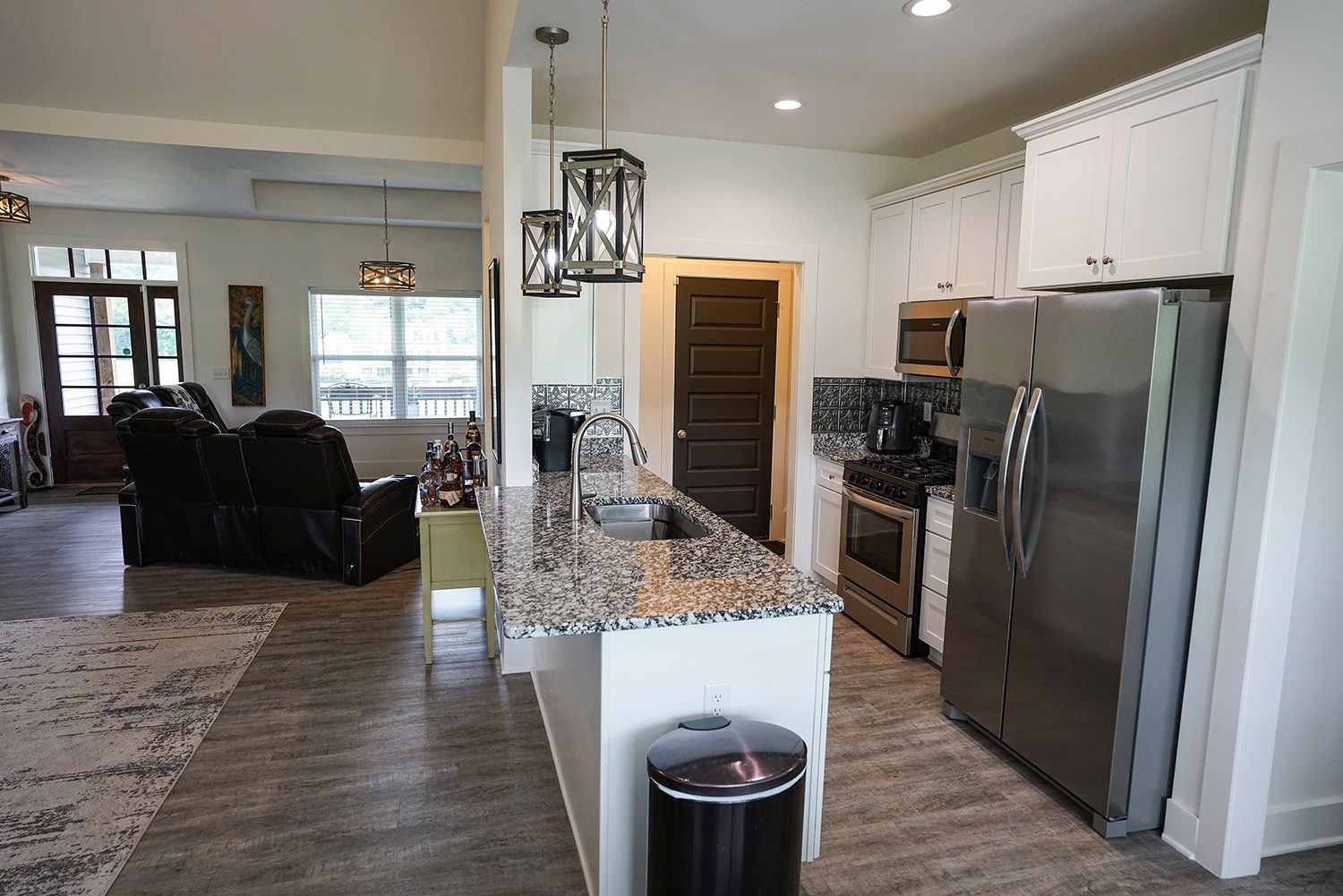124 Piney Road Dickson, TN 37055 - Photo 18 of 39 a kitchen with stainless steel appliances wooden floor dining table and chairs