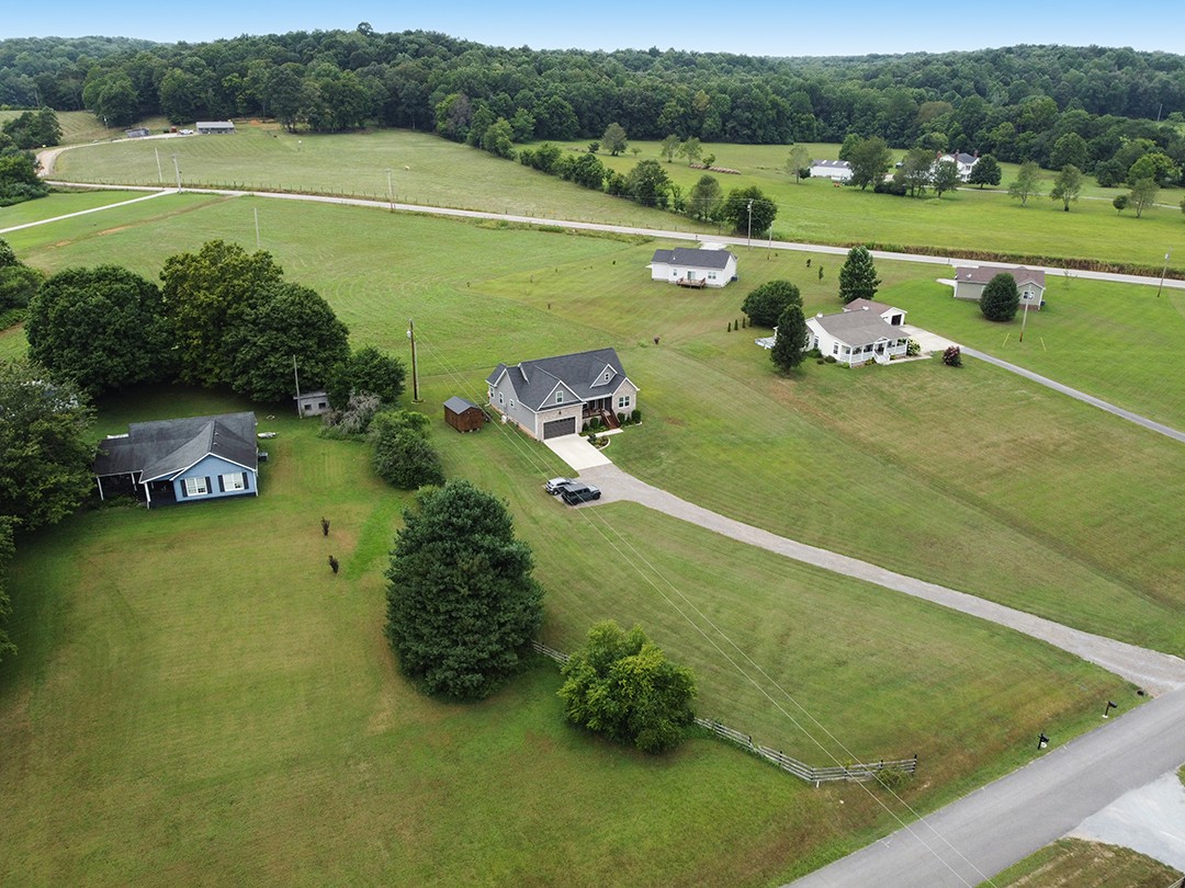 124 Piney Road Dickson, TN 37055 - Photo 2 of 39 a view of a lake with a yard