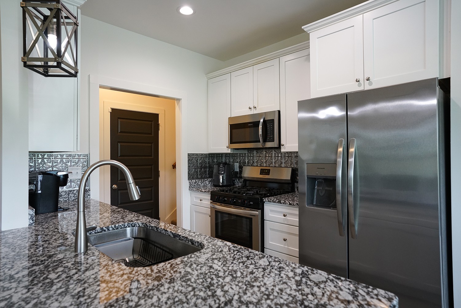 124 Piney Road Dickson, TN 37055 - Photo 22 of 39 a kitchen with a refrigerator stove and a sink