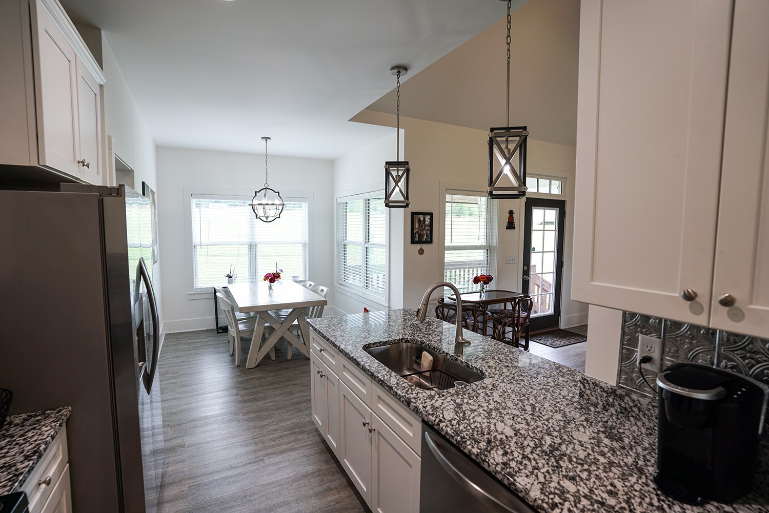 124 Piney Road Dickson, TN 37055 - Photo 24 of 39 a kitchen with stainless steel appliances granite countertop a sink stove and refrigerator