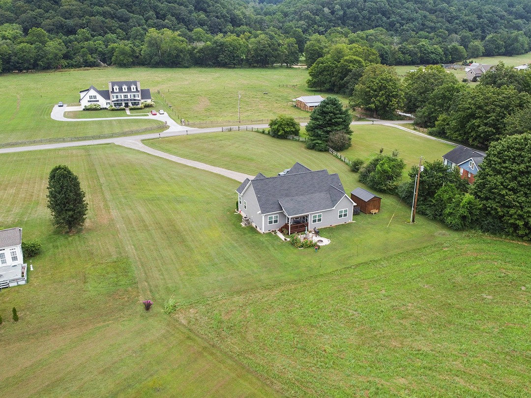 124 Piney Road Dickson, TN 37055 - Photo 3 of 39 a front view of a house with a yard and lake view