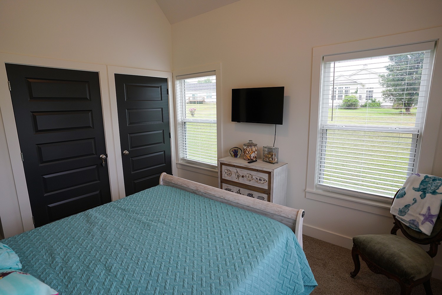 124 Piney Road Dickson, TN 37055 - Photo 33 of 39 a bedroom with a bed and a flat screen tv