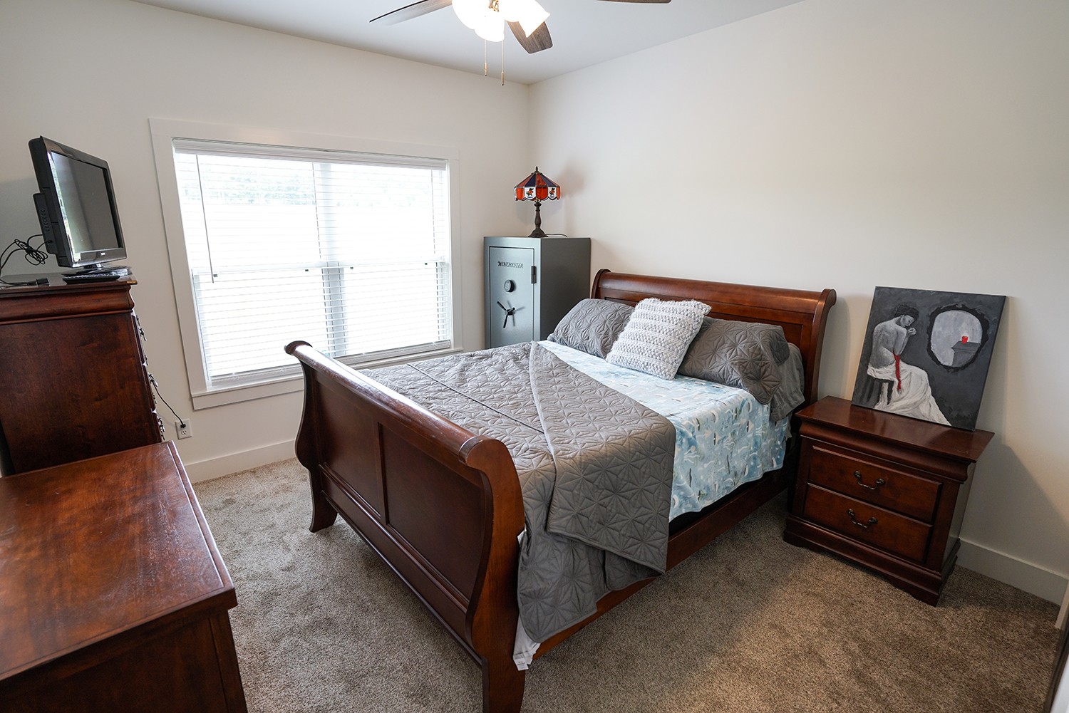 124 Piney Road Dickson, TN 37055 - Photo 34 of 39 a bed room with a bed and a television