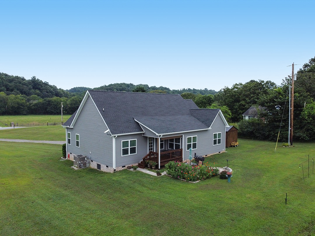 124 Piney Road Dickson, TN 37055 - Photo 6 of 39 a view of a house with a big yard