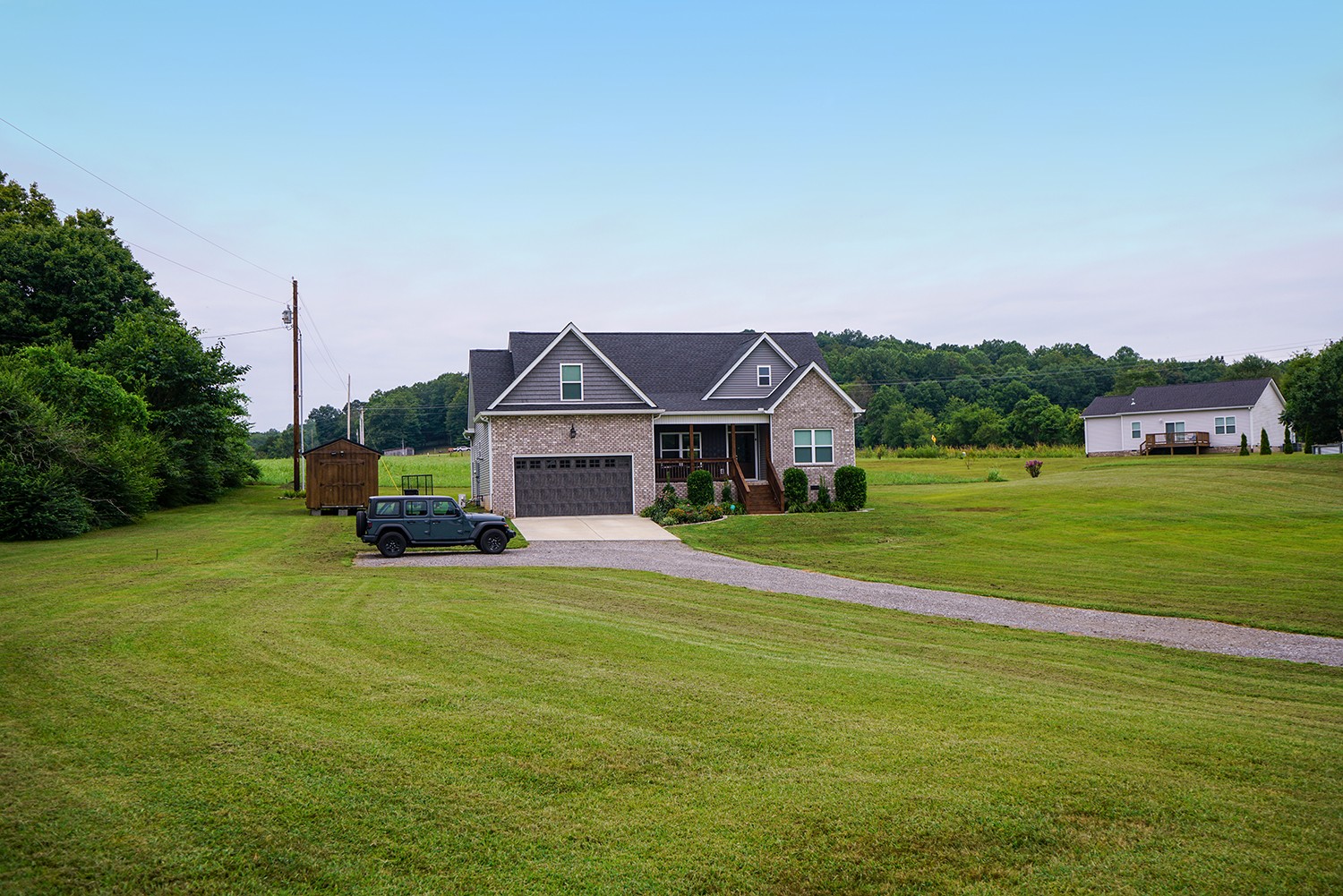 124 Piney Road Dickson, TN 37055 - Photo 10 of 39 a front view of a house with a garden