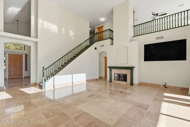 a view of a livingroom with an empty space and a fireplace