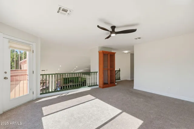 a view of a livingroom with a staircase