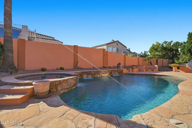 a view of a swimming pool with a lounge chair