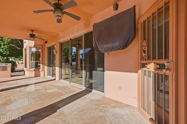 a bedroom with a bed a mirror and a window