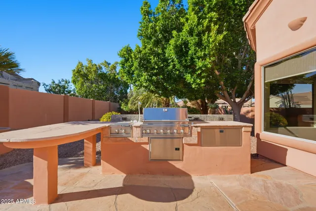 a view of a kitchen with a table and chairs