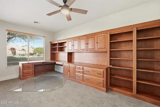 a kitchen with stainless steel appliances cabinets and a window