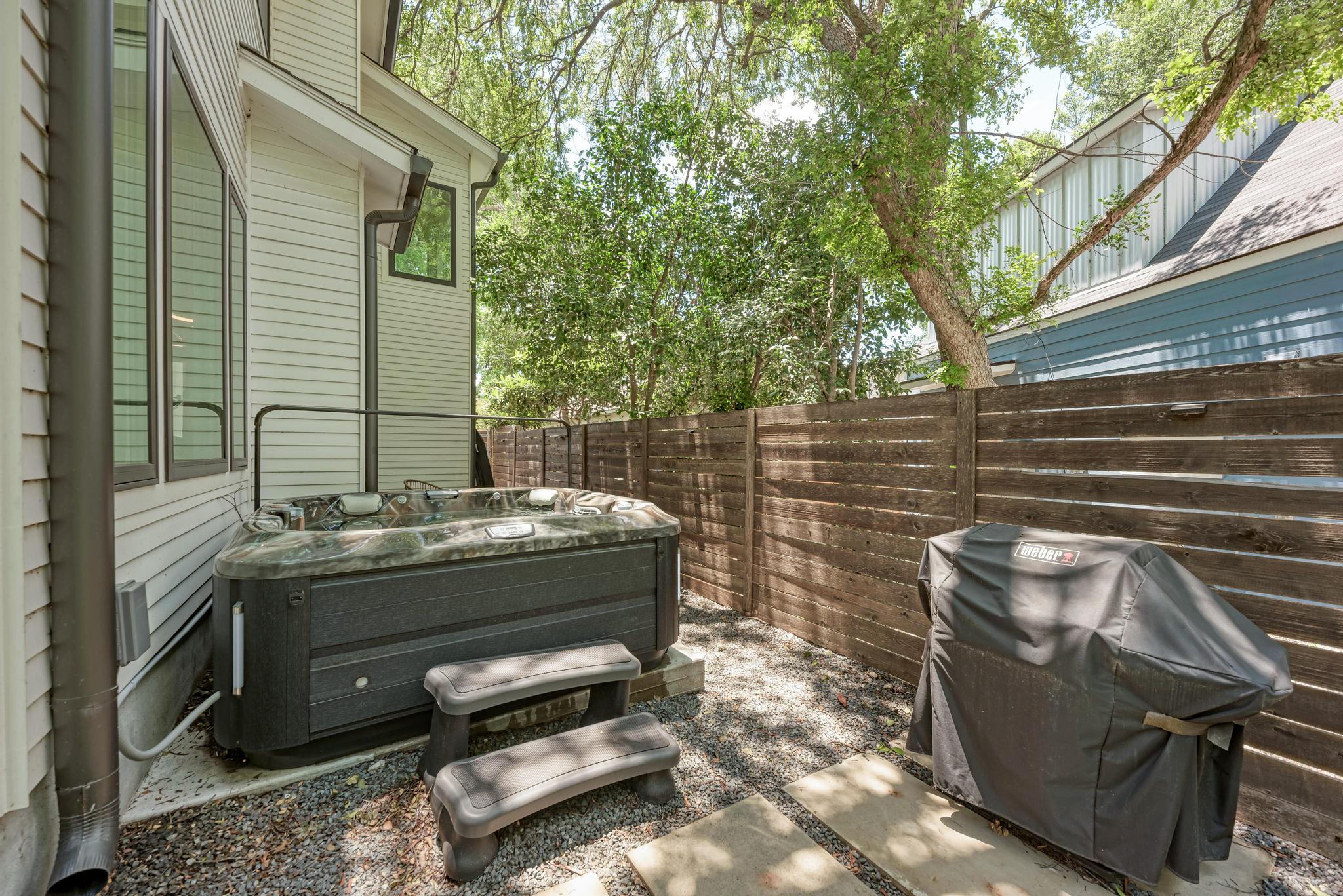 918 Cardinal Lane, Unit A Austin, TX 78704 - Photo 30 of 40 There's also a level side patio perfect for a hot tub where you can soak away your stress under the stars.