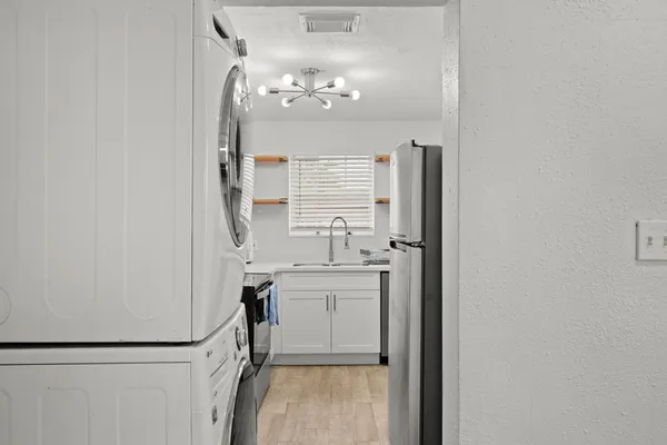 a bathroom with a sink a mirror and a shower