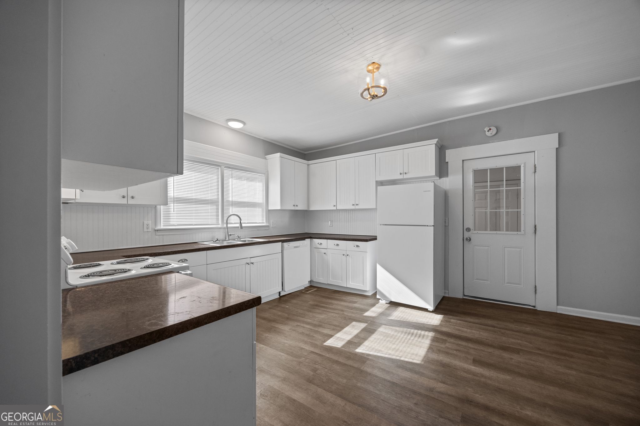 743 Pine Street Trion, GA 30753 - Photo 14 of 31 a kitchen with granite countertop a refrigerator and cabinets