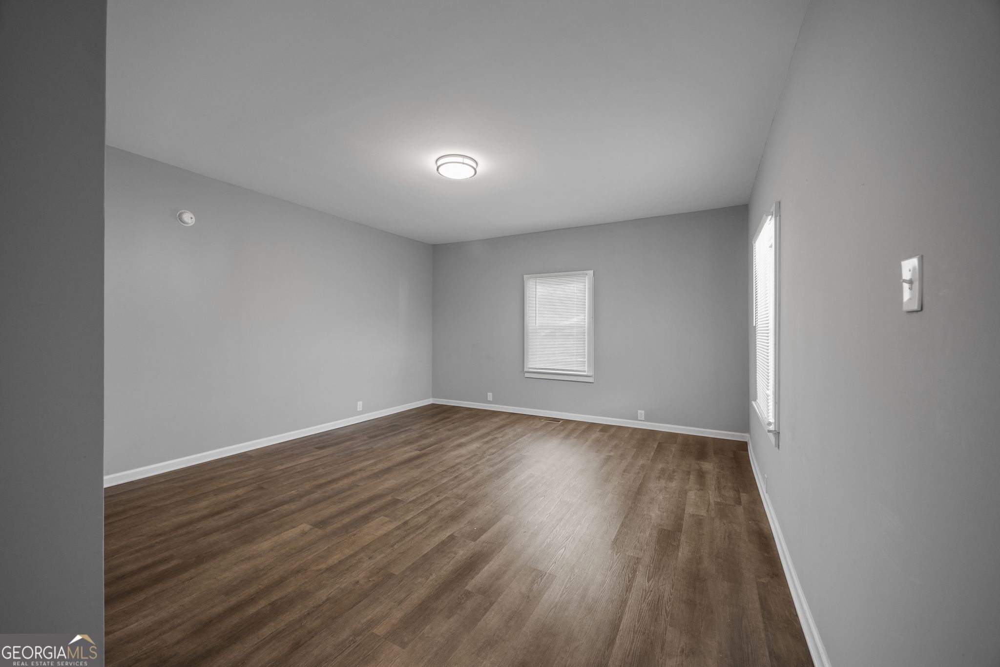 743 Pine Street Trion, GA 30753 - Photo 15 of 31 wooden floor in an empty room with a window