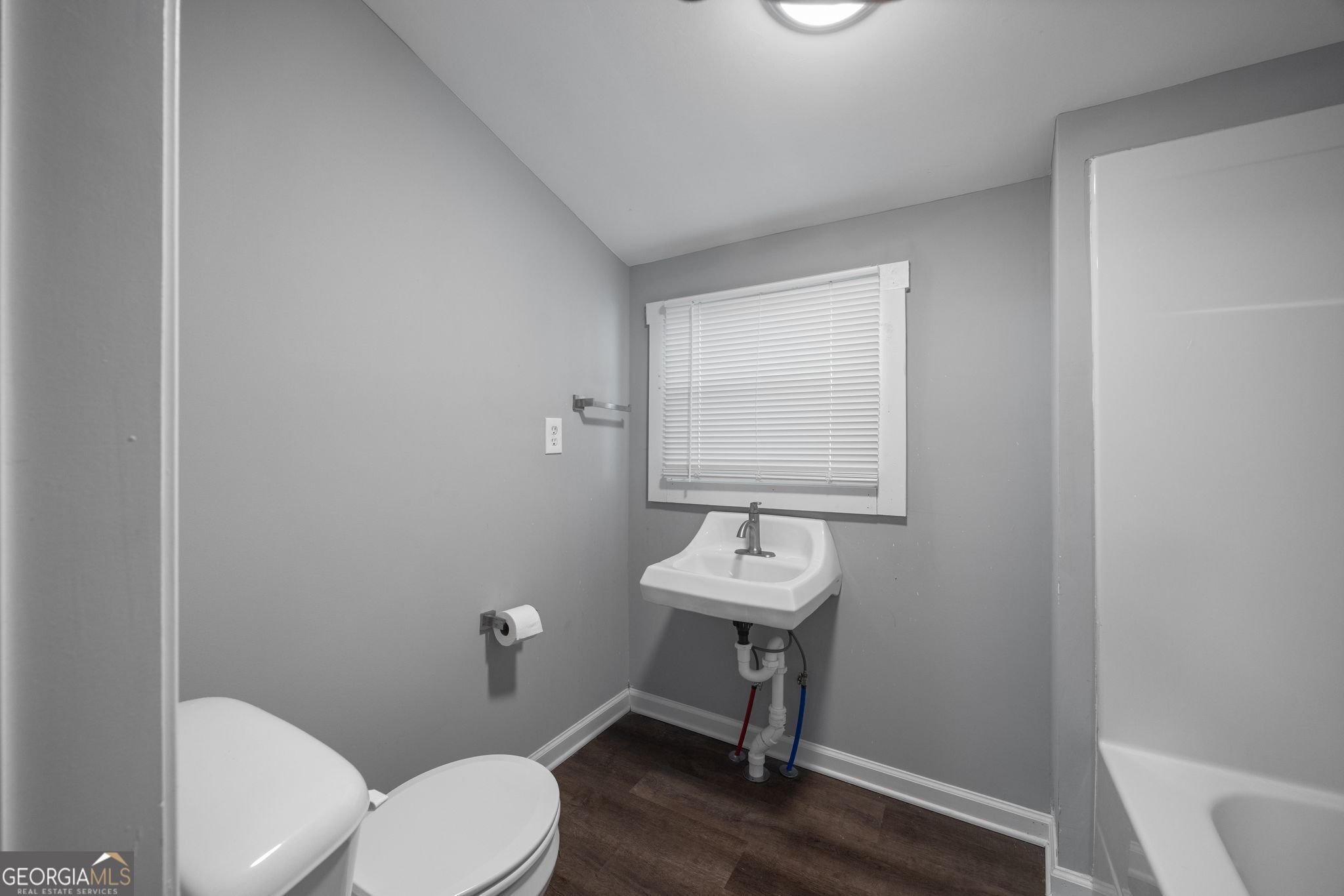 743 Pine Street Trion, GA 30753 - Photo 21 of 31 a bathroom with a toilet a sink and a mirror
