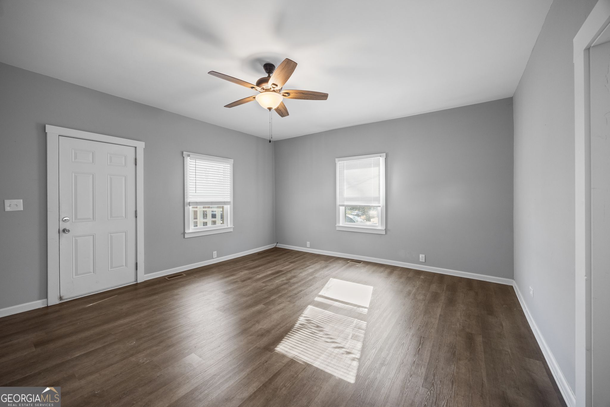 743 Pine Street Trion, GA 30753 - Photo 8 of 31 a view of an empty room with wooden floor and a window