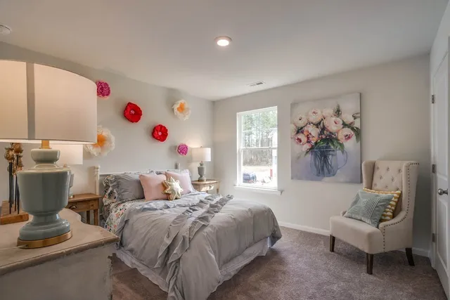 a bedroom with a bed and a couch