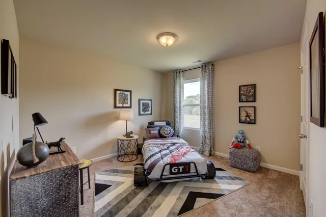 a bedroom with furniture and a chandelier