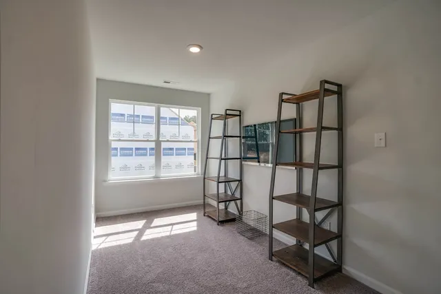 a view of empty room with windows