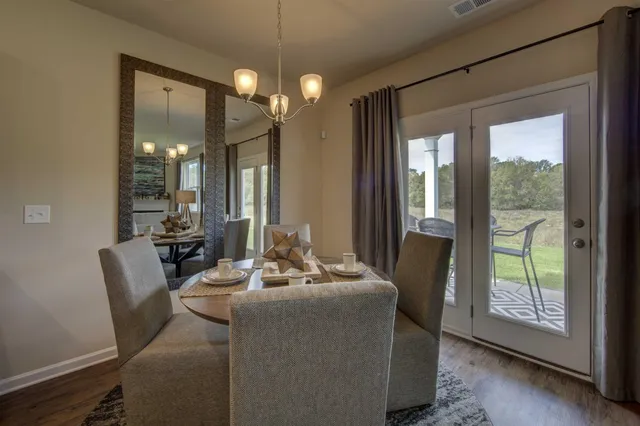 a dining room with furniture and window