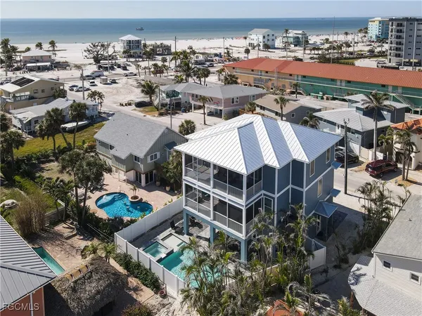 an aerial view of a residential apartment building with a yard