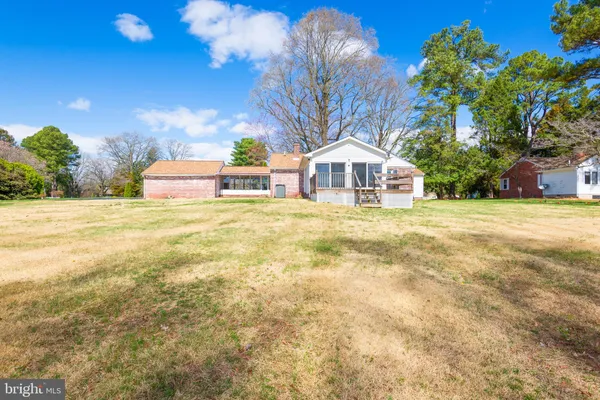 a house with trees in the background