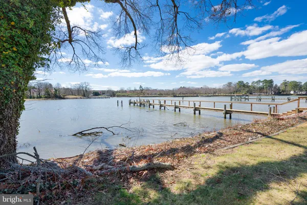 a view of a lake with a yard