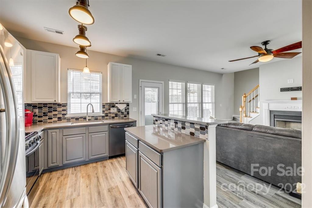 2337 Mirage Place Fort Mill, SC 29708 - Photo 14 of 43 a kitchen with a sink stove and refrigerator