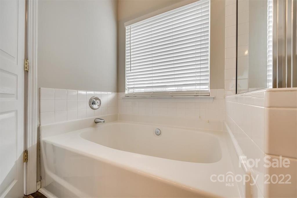 2337 Mirage Place Fort Mill, SC 29708 - Photo 31 of 43 a white bath tub sitting next to a window