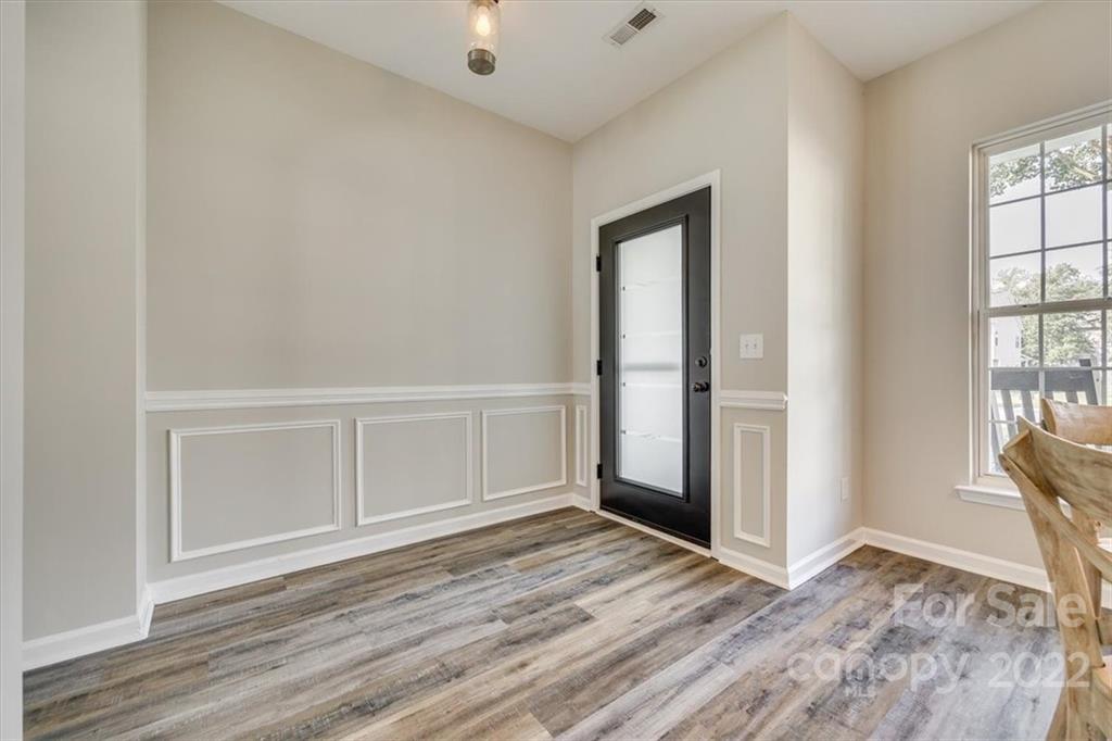 2337 Mirage Place Fort Mill, SC 29708 - Photo 5 of 43 an empty room with wooden floor and windows