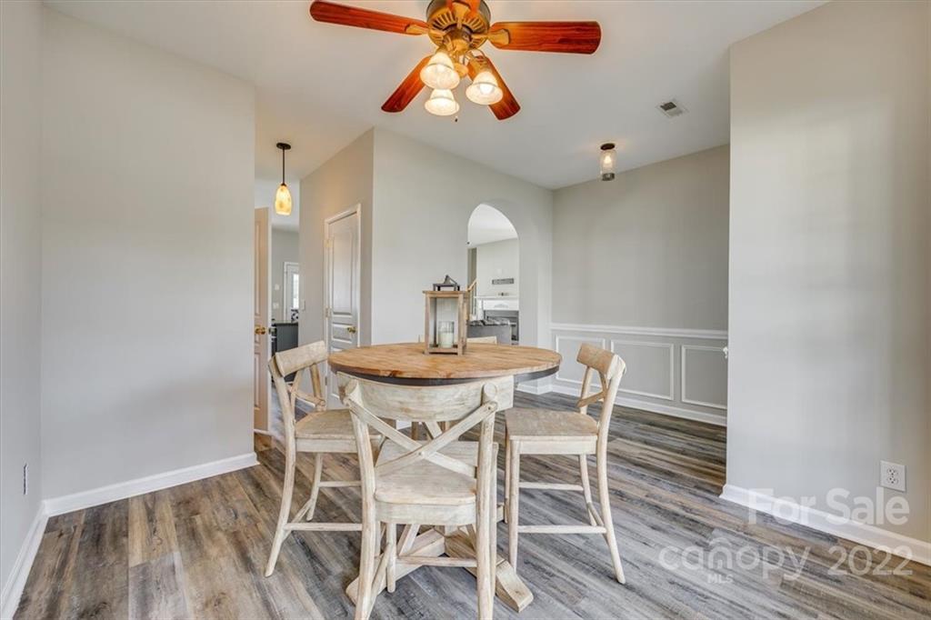 2337 Mirage Place Fort Mill, SC 29708 - Photo 8 of 43 a view of a dining room with furniture and wooden floor