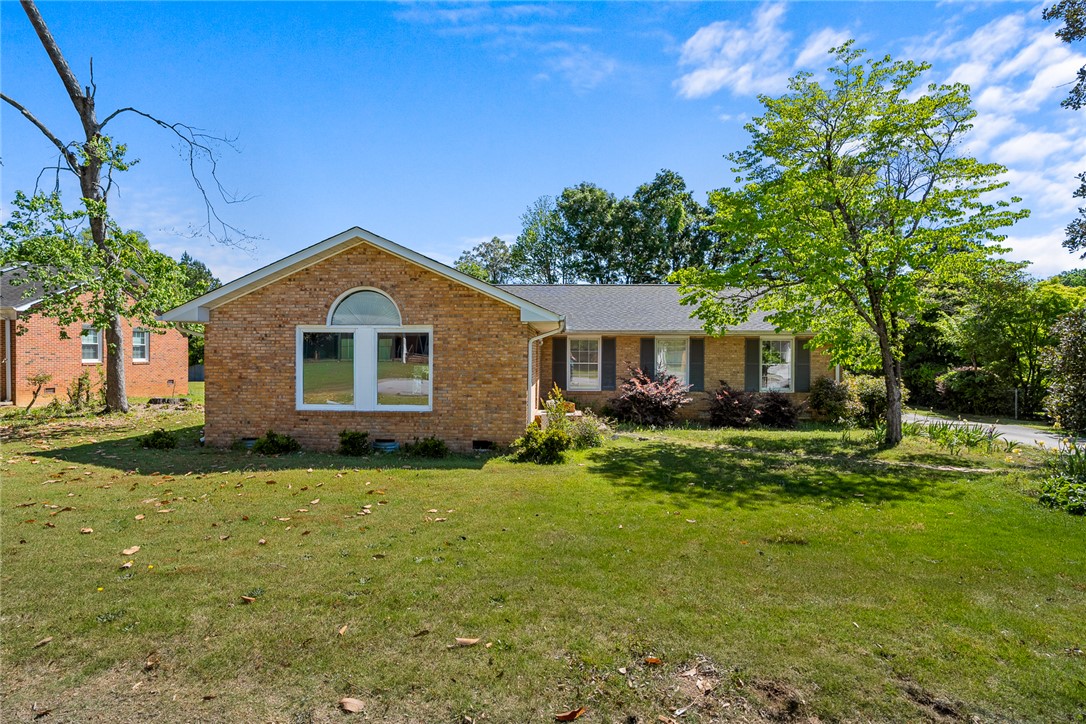 A classic brick residence offering comfortable living with a well-maintained exterior and inviting curb appeal.