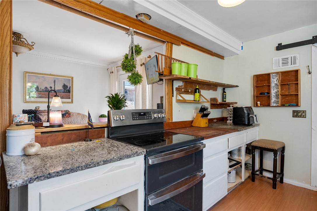 605 Sherry Drive Anderson, SC 29621 - Photo 13 of 36 This kitchen features a double oven and granite countertops, creating a perfect blend of style and functionality.