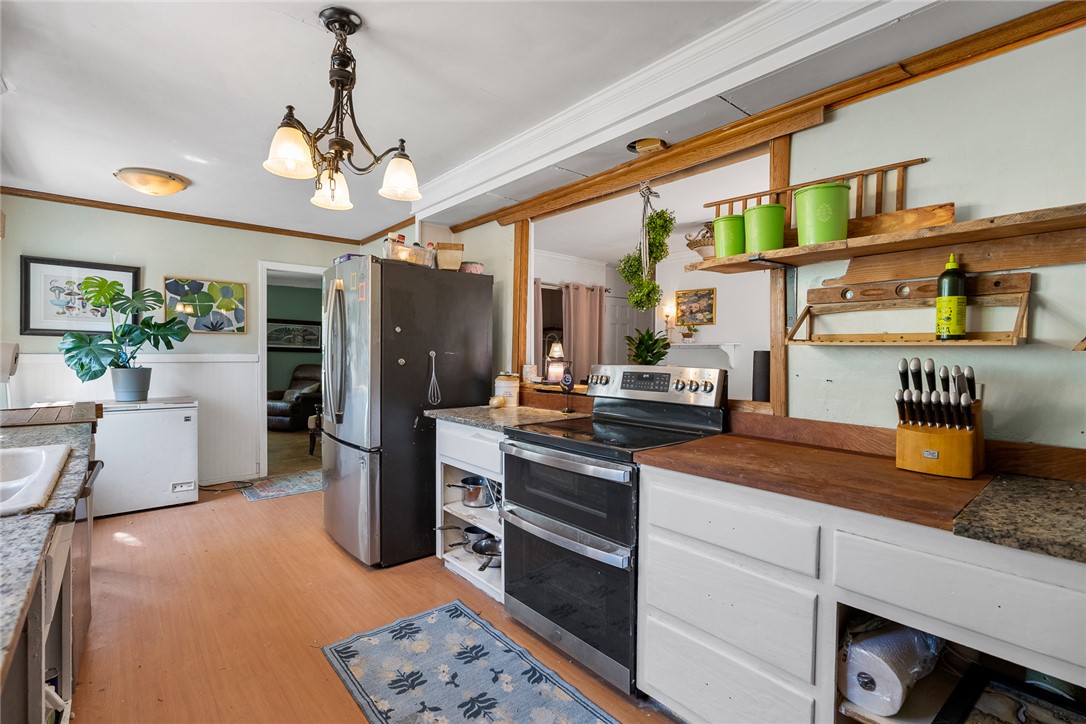 605 Sherry Drive Anderson, SC 29621 - Photo 14 of 36 This bright kitchen features a double oven and a stainless steel refrigerator.