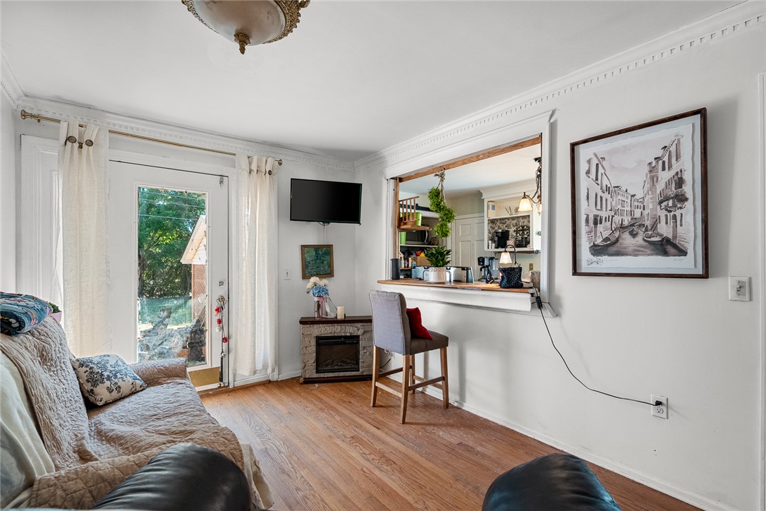 605 Sherry Drive Anderson, SC 29621 - Photo 15 of 36 This inviting living space features wood floors and crown molding, perfect for comfortable gatherings.