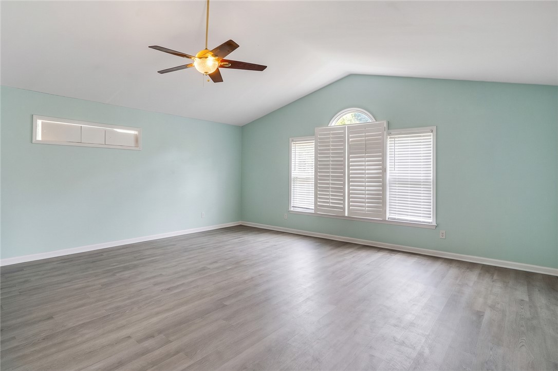 605 Sherry Drive Anderson, SC 29621 - Photo 18 of 36 This airy room features vaulted ceilings and modern flooring, creating a bright and welcoming atmosphere.